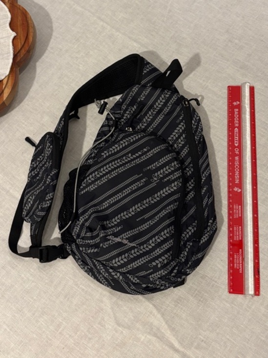 Eddie Bauer Handbags - Eddie Bauer Black and Gray Patterned Sling Backpack